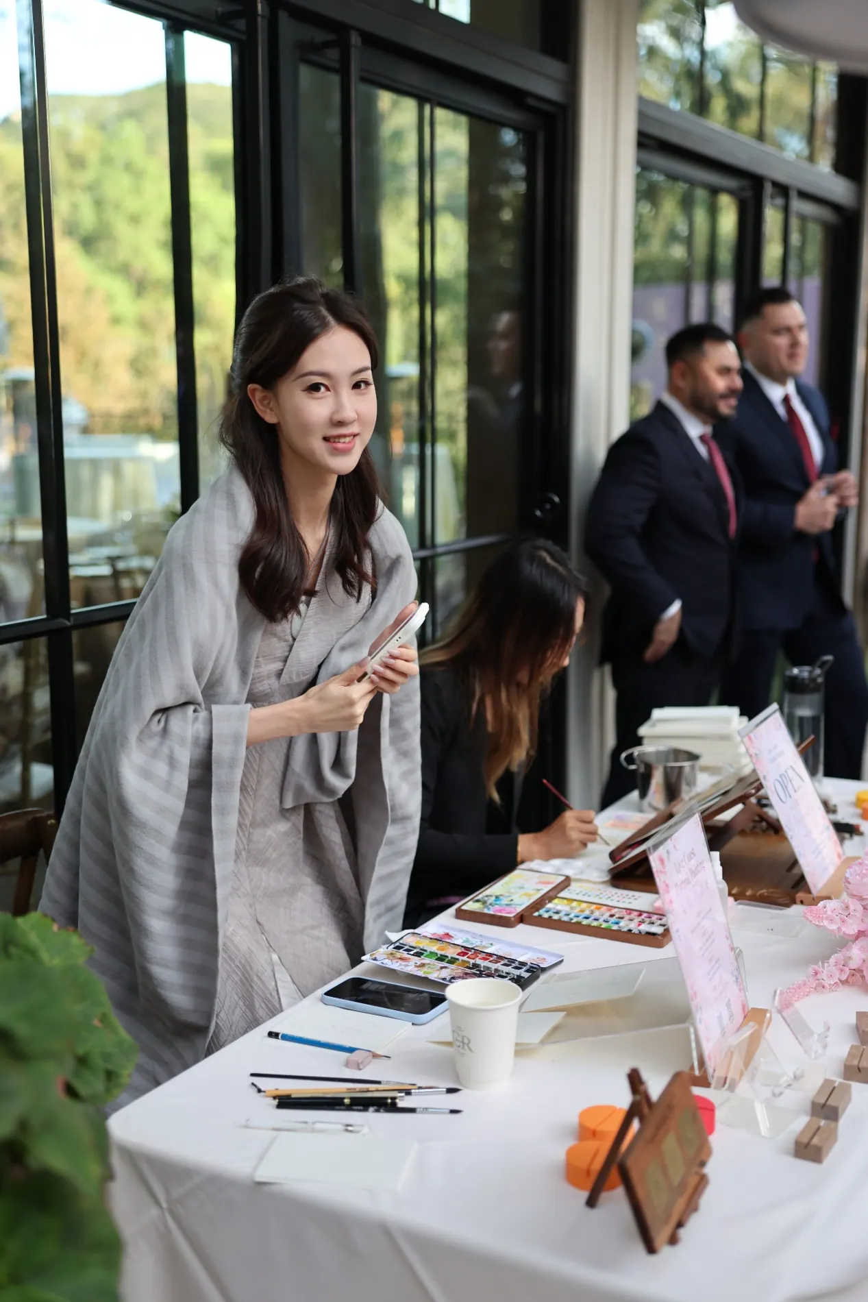 Hannah welcoming guests at a wedding