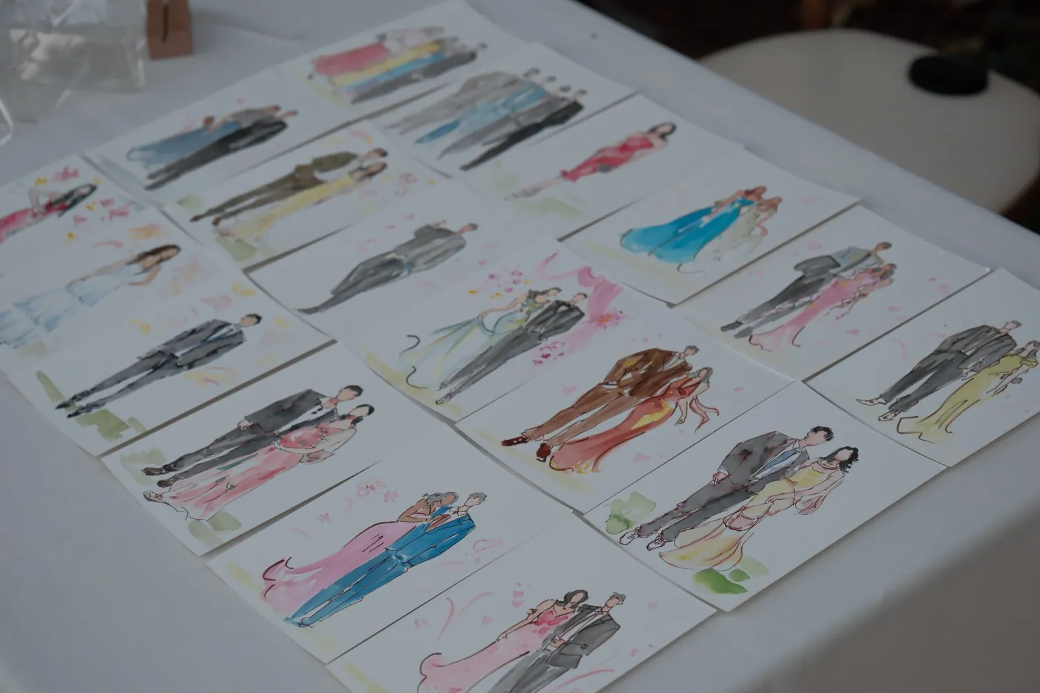 Hand-painted fashion sketches at a wedding